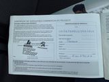 a picture of a person holding a certificate in their hand