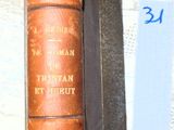 un vieux livre posé sur une table, avec une étiquette de prix dessus