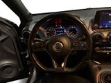 the interior of a car with a steering wheel and a dash board