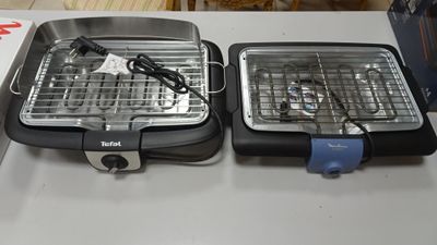 two grills that are sitting on a table