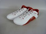 a close up of a pair of white and red shoes