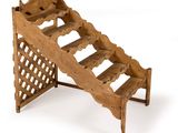an image of a wooden wine rack on a white background
