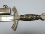 an image of a sword with a metal handle