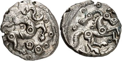 a silver coin with an image of a horse on it