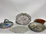 five different types of dishes on a white table