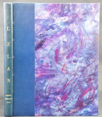 a blue book sitting on top of a table next to a purple book