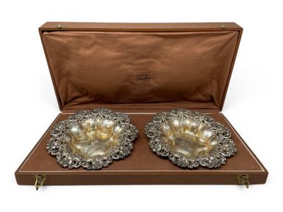 a pair of silver plated bowls in a leather case
