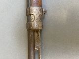 a metal object with a wooden handle attached to it
