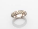 a white gold ring with diamonds on a white background
