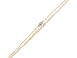 un bracelet en perles et diamants