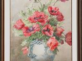 painting of red poppies in a blue vase on a table