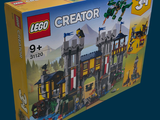 a box with a lego creator set inside of it