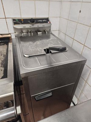 a silver stove and a silver oven in a kitchen
