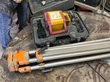 a man that is standing next to some tools on a table