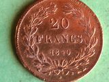 a close up of a coin on a table with a green background