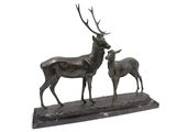 statue of a stag and a baby stag on a wooden base