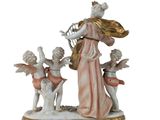 an image of a figurine of a woman with angels and a harp