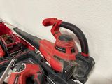 a picture of a corded sander and other tools in a box