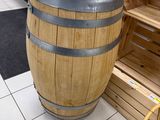 a wooden barrel sitting in the middle of a store