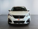 the front view of a white car in a showroom