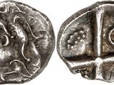 a silver coin with an image of a man ' s face on it