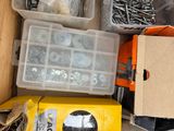 a box full of screws and nuts and a box of screws and nuts
