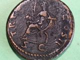 a coin with a picture of a man riding a horse