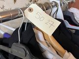 a hanger that has clothes on it with a price tag on it