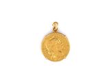 une pièce d'or sur laquelle est représenté le visage d'une femme