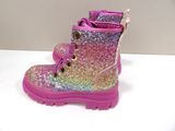 pink and purple glitter boots with laces on top of a white table