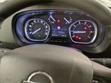 a steering wheel and dashboard of a car with various gauges