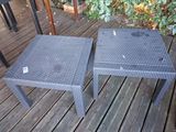 a table and a chair on a wooden deck