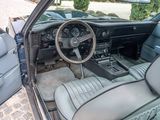 a car with a steering wheel and a dash board