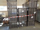 many crates stacked up in a warehouse with a red and white striped tape