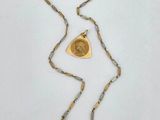 an image of a gold necklace with a heart on it