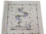 an image of a quilt with birds and flowers on it