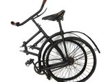 a black bicycle with a wooden handlebar attached to it