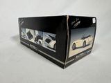 the box is open on a white surface with a picture of a sports car in it