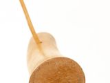 a wooden toy with a wooden handle on a white background