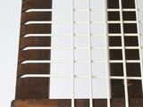 a close up view of a wooden table with a woven seat