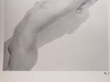 black and white photograph of a nude woman laying on her back