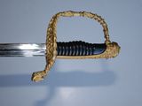 a close up of a sword with a rope on it