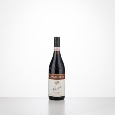 a bottle of red wine sitting on top of a table