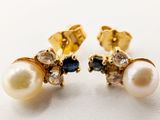 une photo d'une paire de boucles d'oreilles en perles et saphirs