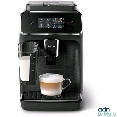 an image of a coffee machine with a glass of milk