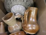 a box full of vases and other items that are in it