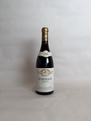 a bottle of wine that is sitting on a table