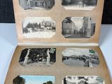 an old photo of an open book with pictures of a building