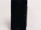 a cell phone sitting on a stand on a table