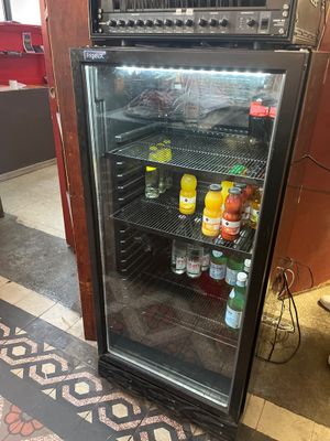 a refrigerator that has a lot of drinks inside of it